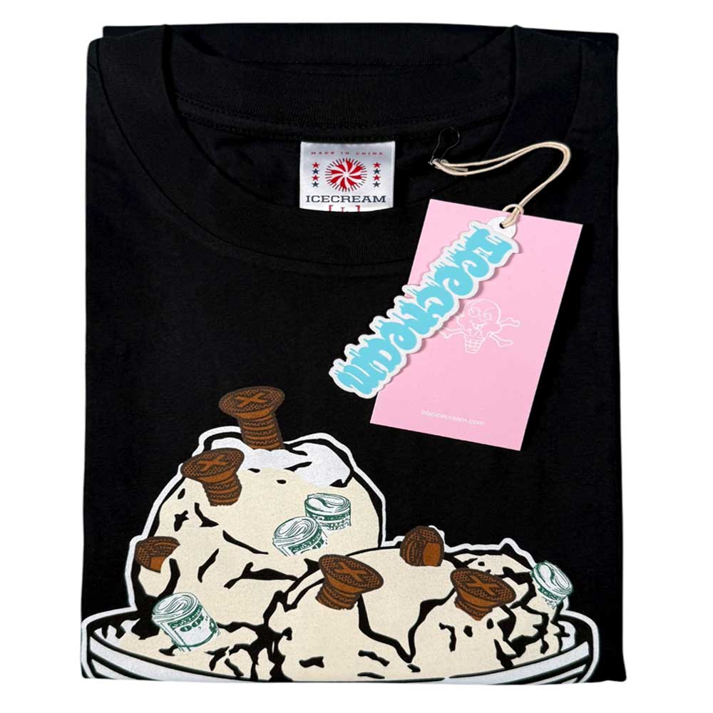 The Bronze 56K x Ice Cream 56,000 Flavors Tee Black is a folded tee with two ice cream scoop graphics topped with brown screws and dollar bills, plus a pink hang tag on the collar.
