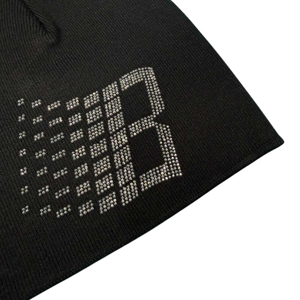 A close-up of the Bronze 56K x Ice Cream Rhinestone Beanie Black shows black fabric adorned with tiny white dots forming a 'B,' echoing the beanie's signature sparkling rhinestone detail.