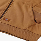 Close-up of the Brown Duck Zip Through Hoodie Thrasher Magazine x Dickies Skateboarding A887J OBD, featuring a relaxed fit, ribbed hem, pockets, and a small Dickies x Thrasher logo patch by the pocket that highlights textured stitching.