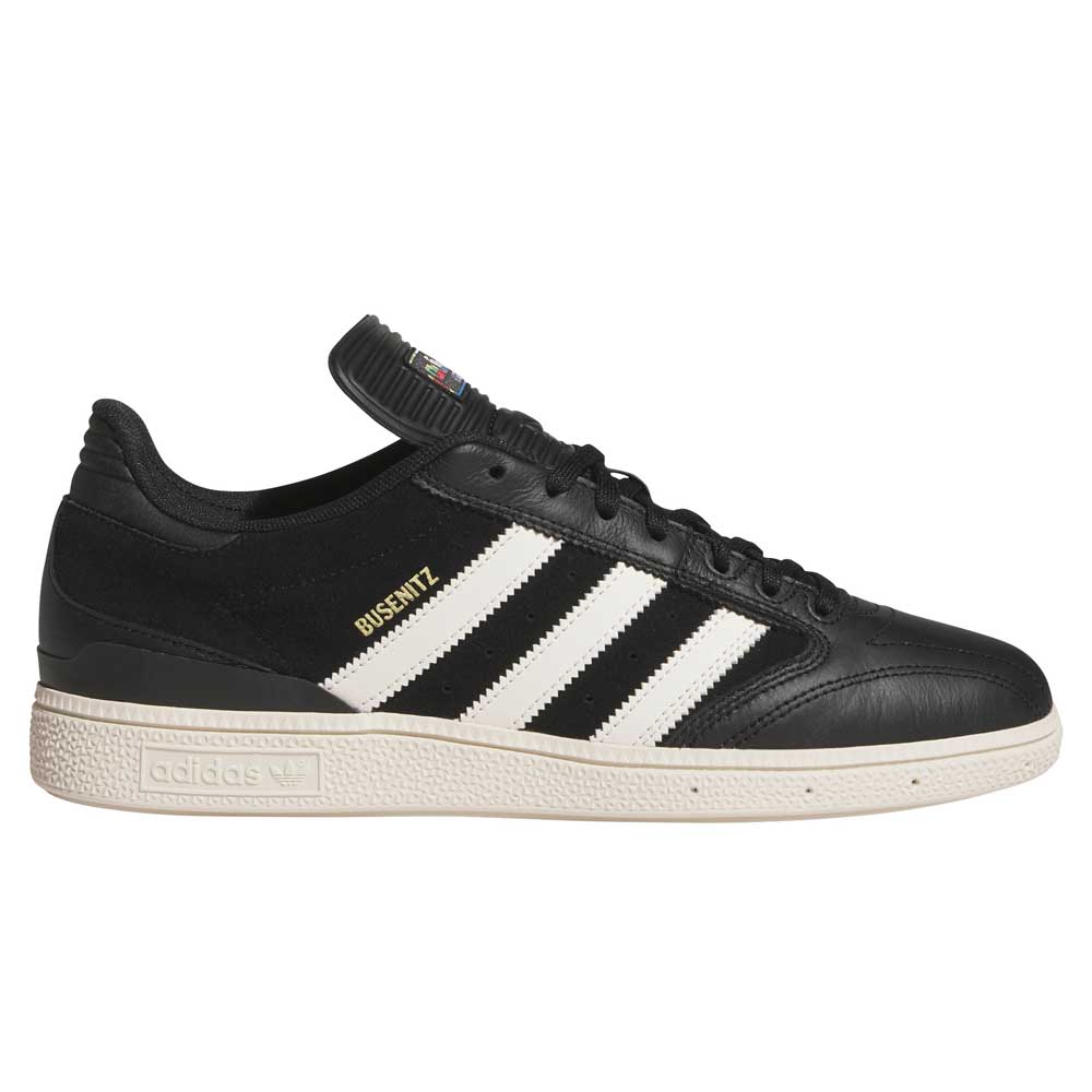 Side view of Busenitz Black White HQ4708 Adidas Skateboarding Suede Shoes: black upper with white stripes, tan sole, gold "Busenitz" text, padded tongue with Adidas logo—designed for durability and style in skateboarding.