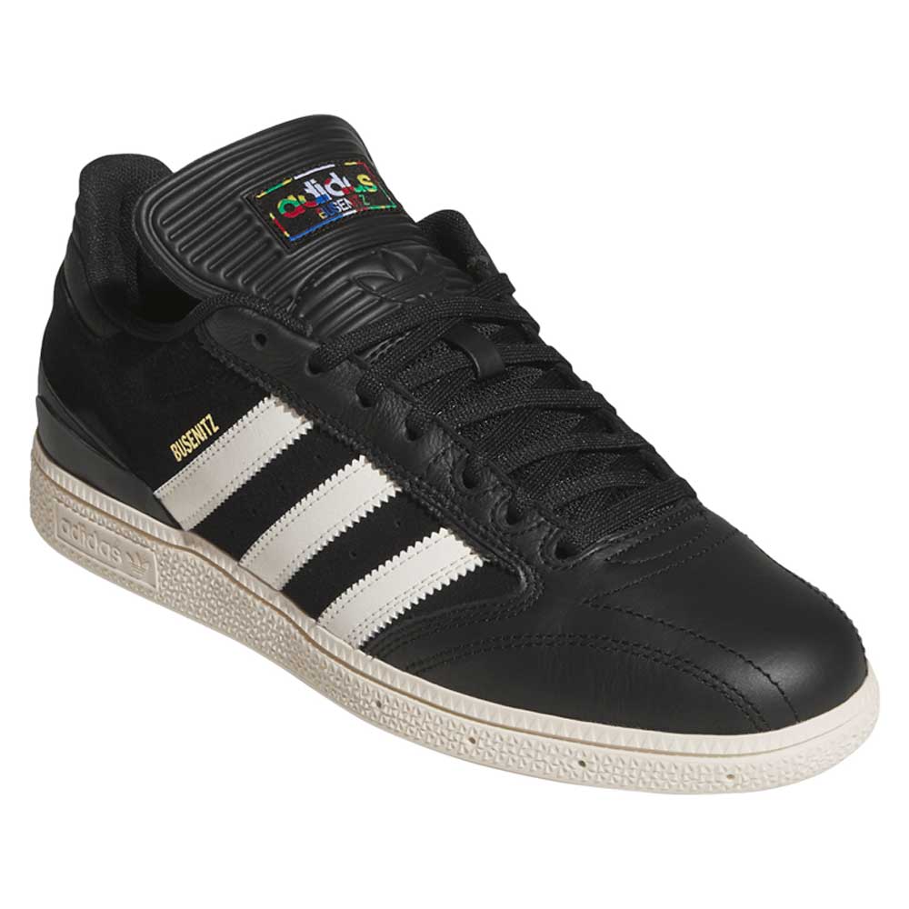The adidas Busenitz Black White HQ4708 skateboarding suede shoes feature white stripes, a white sole, BUSENITZ in gold on the side, and a colorful Adidas logo on the tongue—built for durability, style, and top skate performance.