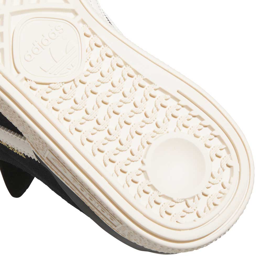 Close-up of the sole on the Busenitz Black White HQ4708 Adidas Skateboarding Suede Shoes, featuring a textured patterned grip, raised edge, and embossed Adidas logo—reflecting the durable design inspired by classic Busenitz skate shoes.