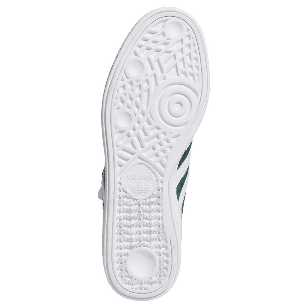 The image shows the white textured sole of the Busenitz HQ7534 Green White Adidas Skateboarding Suede Shoes, with circular grip patterns and an embossed Adidas logo with trefoil symbol near the heel.