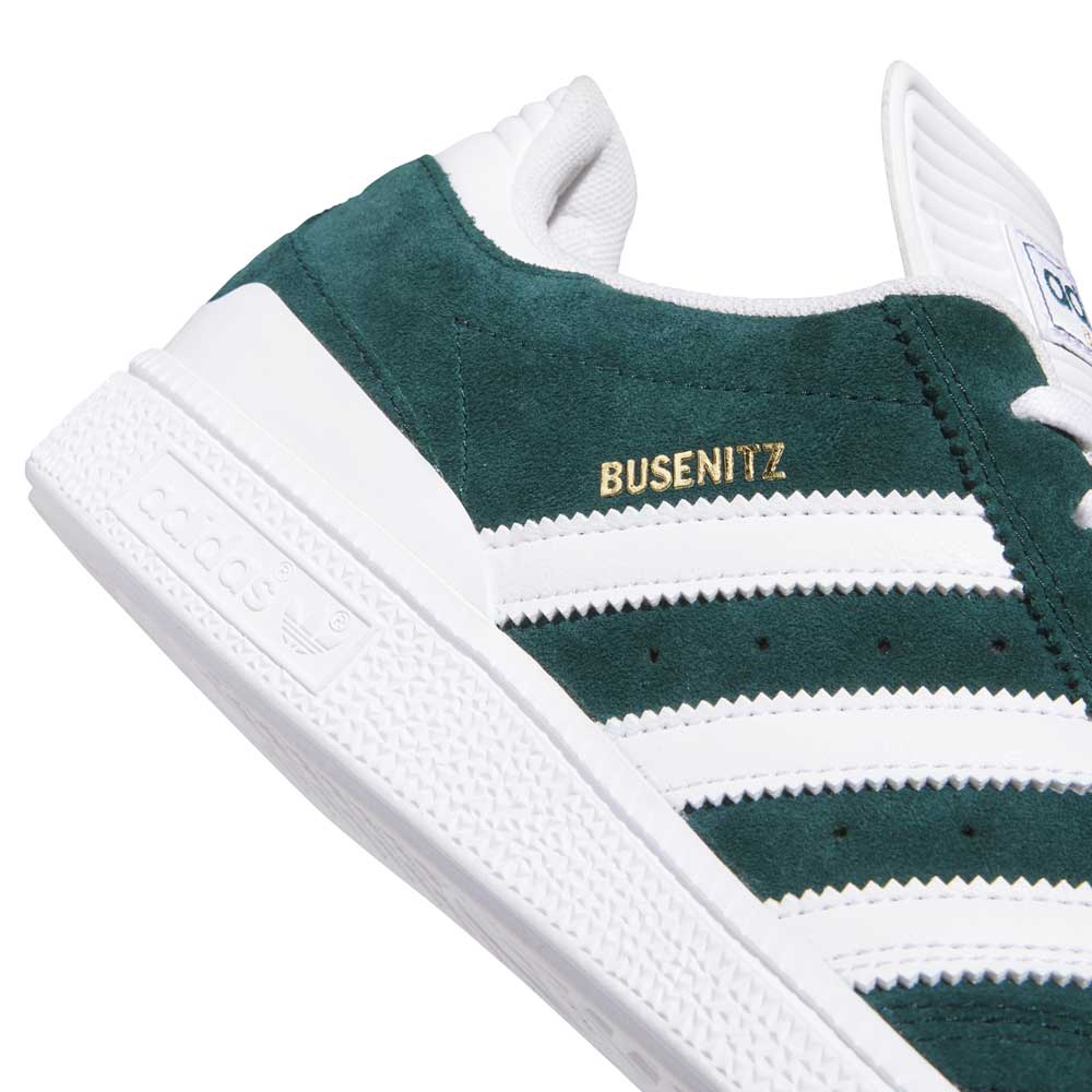 Close-up of the Busenitz HQ7534 Green White Adidas Skateboarding Suede Shoes, featuring green suede uppers, white stripes, a textured white sole, and "BUSENITZ ADV" in gold on the side.