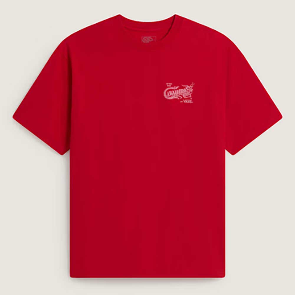The Caballero VN000XHBIZQ1 Racing Red Short Sleeve Tee from Vans Skateboarding features a loose fit, small white dragon and text on the upper left chest, set against a light beige background.