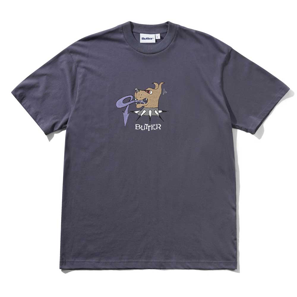 The Canine Anchor Blue Tee by Butter Goods features a cartoon dog biting a purple vinyl above "BUTTER" in white, with a brand label on the collar.