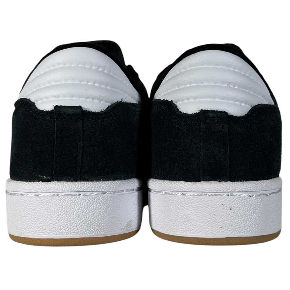 A pair of Adidas Centennial 85 Low ADV Skateboarding sneakers in black, gray, and white suede seen from the back, with textured white soles and padded white heel sections.