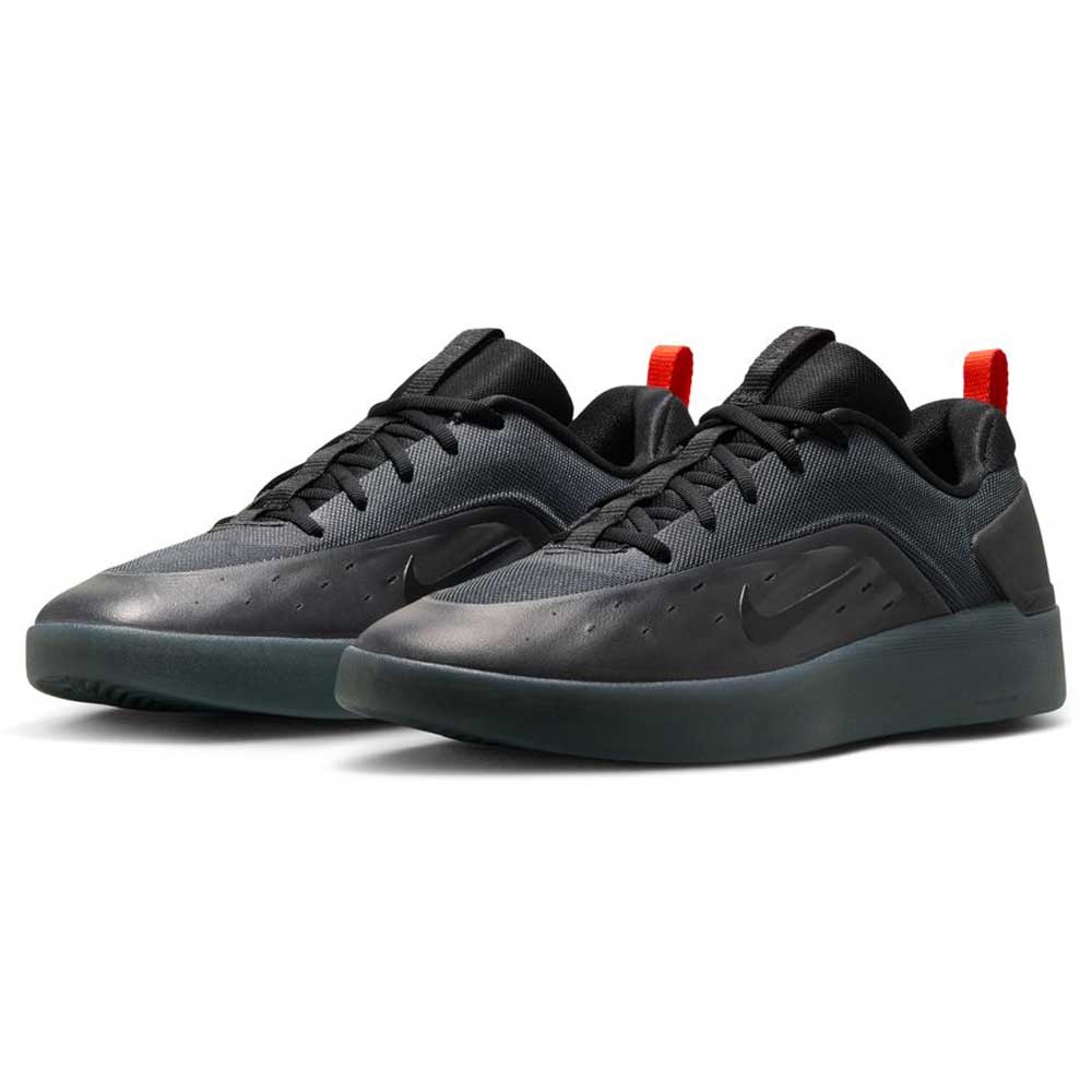 The Cool Grey White FQ1273003 Zoom Nyjah 4 Nike SB Skateboarding Shoes feature reinforced mesh uppers, dark soles, subtle swooshes, black laces, and red heel pull tabs, displayed on a white background.
