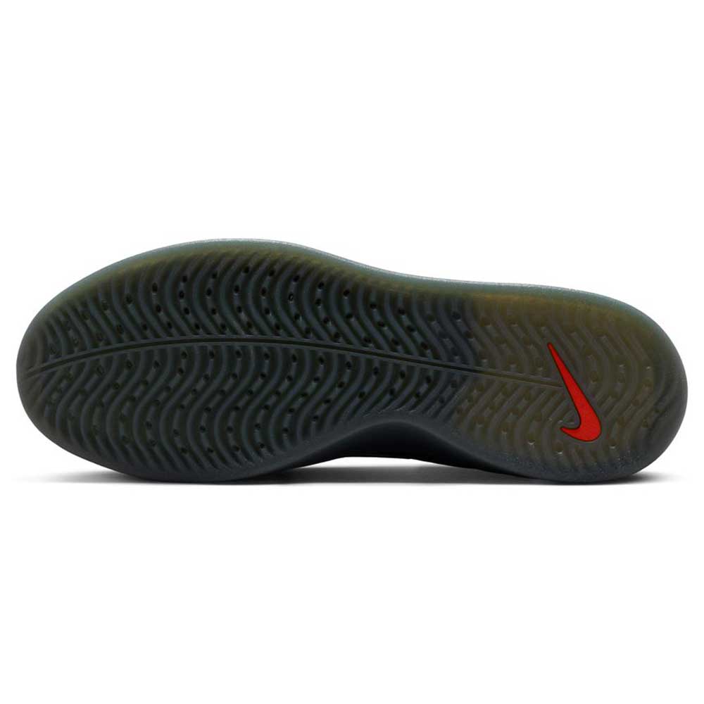The image shows the sole of the Cool Grey White FQ1273003 Zoom Nyjah 4 Nike SB Skateboarding Shoe, featuring a wavy tread pattern, HART outsole, red Nike Swoosh near the heel, and a mainly black translucent sole.