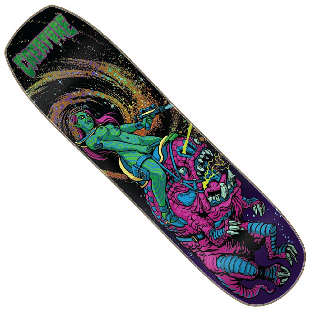 The Cosmo Rider SM 8.50in x 32.05in Creature Decks features a vibrant cosmic design with a green-skinned space woman wielding a ray gun as she rides a pink, multi-eyed monster, set against an outer-space backdrop; “Creature Cosmo Riders” and “CREATURE” are displayed in green at the top left.