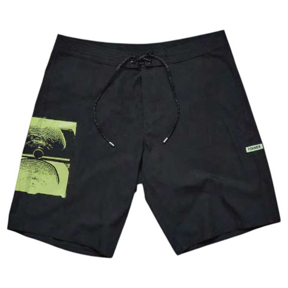 The Illusion 21 inch Trunk Black Former features black board shorts with a green abstract graphic on the left leg, a small white rectangular “Former” tag on the right leg, and a black drawstring at the waistband.