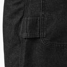 Close-up of heavyweight denim with visible stitching and a rectangular flap pocket on the left—an elevated detail featured in the DDSK68 Loose Fit Denim Pant Carpenter Black by Dickies Skateboarding.