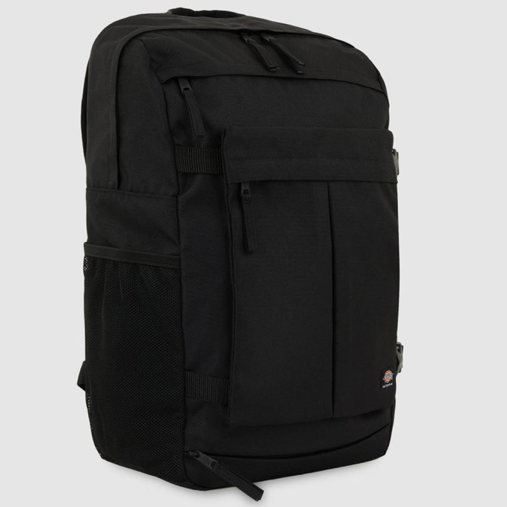 The A8675BLK Black Mike Anderson Pro Skate Dickies Skateboard Strap Backpack features multiple zippered compartments, a front pocket, side mesh pocket, subtle logo, and skate straps, shown on a light gray background.
