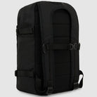 The A8675BLK Black Mike Anderson Pro Skate Dickies Skateboard Strap Backpack is shown from the back, featuring padded shoulder straps, a chest buckle, adjustable side straps, skate straps, and a cushioned back panel.