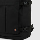 Close-up of the A8675BLK Black Mike Anderson Pro Skate Dickies Skateboard Strap Backpack with buckle skate straps and a small Dickies logo patch near the bottom, set against a light gray background.