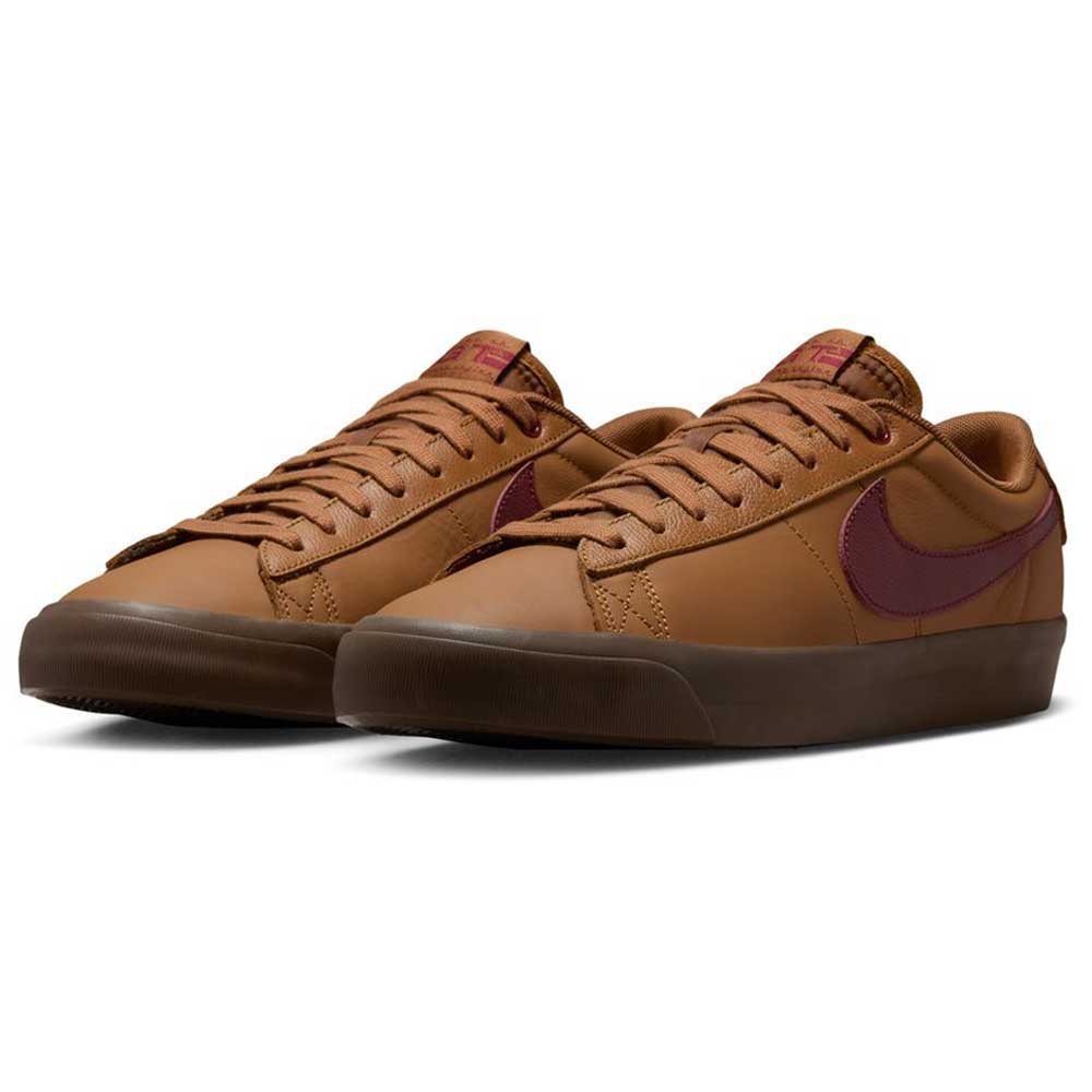 The DV1226-200 GT Dark Red Brown Blazer Low Nike SB Suede Skateboarding Shoes feature brown suede, dark burgundy swoosh logos, brown laces, and dark brown soles—stylish and perfect for any skateboarding look. Displayed on a white background.