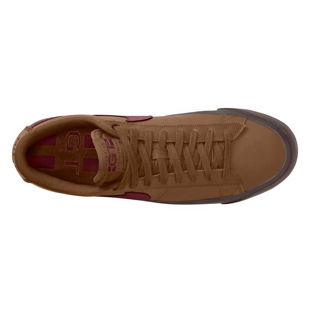 Top view of the DV1226200 GT Dark Red Brown Blazer Low Nike SB suede skateboarding shoe featuring brown laces, a dark brown rubber toe, and a maroon logo inside.
