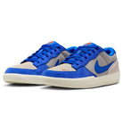 The DV5477-011 Force 58 Nike SB Skateboarding Shoes feature college grey and racer blue suede overlays, white soles, blue swooshes and laces, plus orange accents on the tongue and toe for a heritage basketball-inspired look.