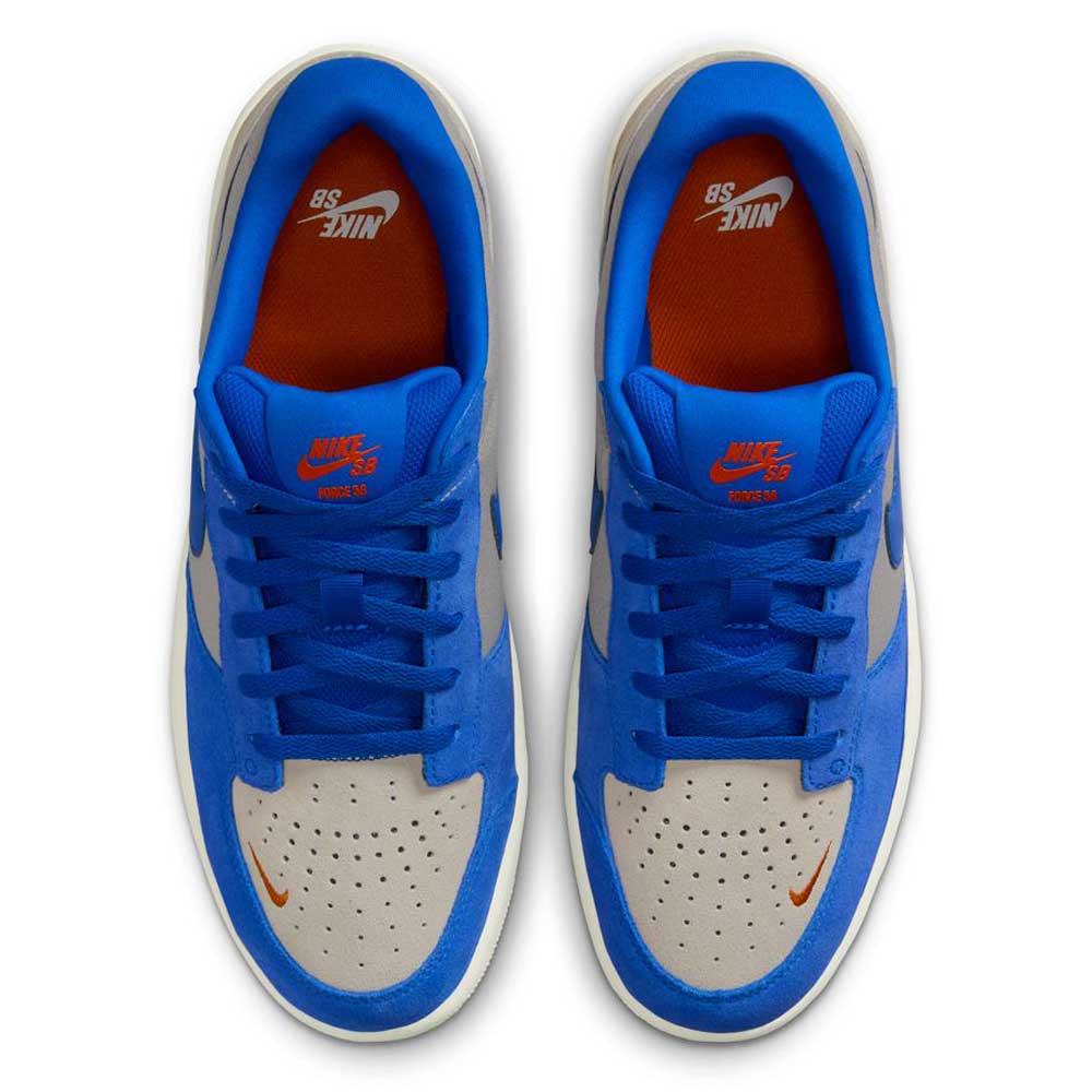 Top view of DV5477-011 College Grey Racer Blue Light Orewood Force 58 Nike SB suede skateboarding shoes, featuring blue suede overlays, white leather toes, orange Nike logos, and blue laces—fusing classic basketball style with a modern skate cupsole.