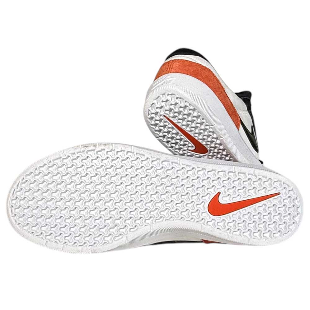 The DV5477100 Black Cosmic Clay White Force 58 Nike SB suede skateboarding shoes are shown: one upright and one on its side, with white textured soles, an orange Nike swoosh on the bottom, and an orange accent on the heel.