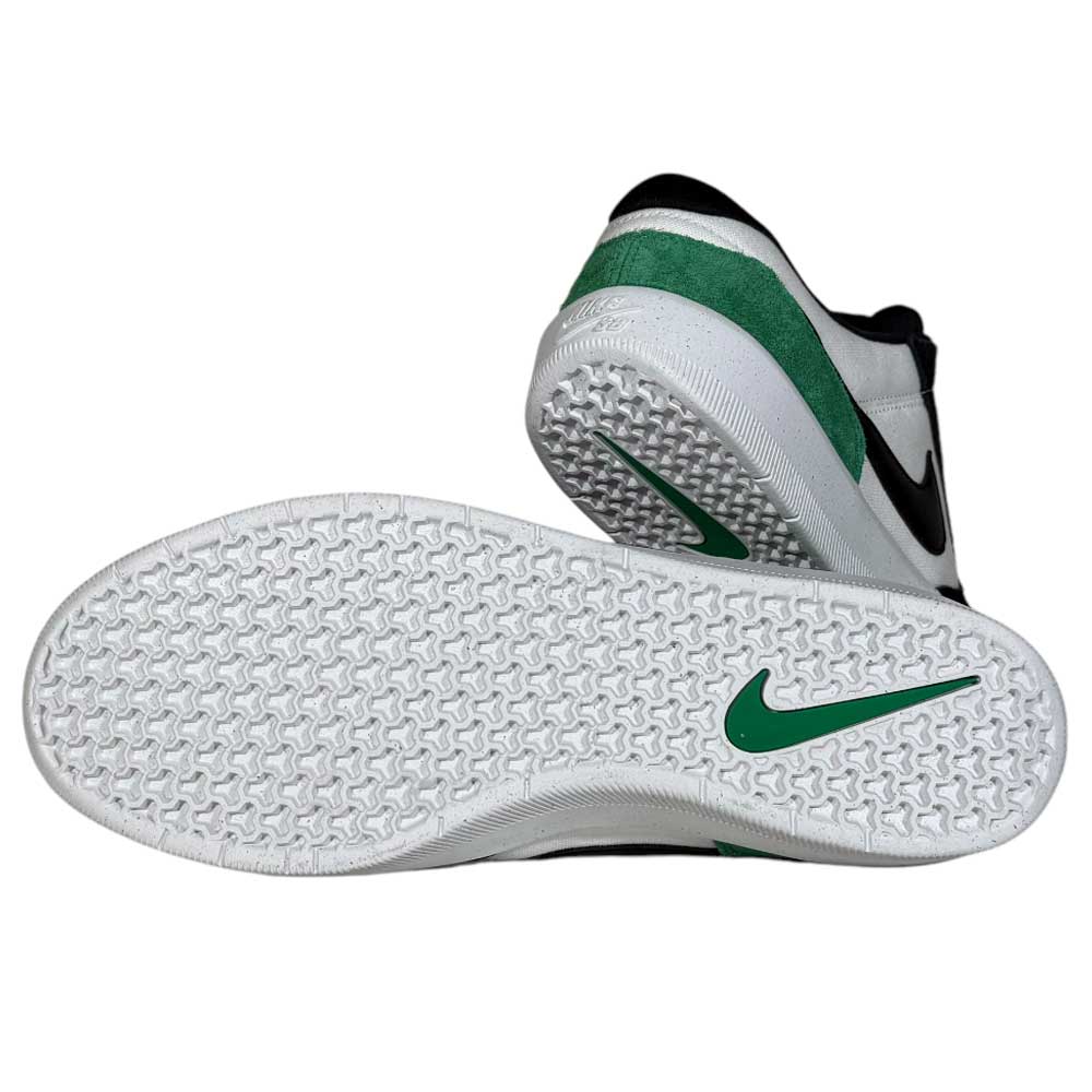 A pair of DV5477101 White Black Stadium Green Force 58 Nike SB Suede Skateboarding Shoes—one upright with a black Swoosh, the other on its side, showing the textured cupsole and green Nike logo.