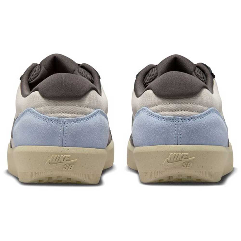 The DV5477102 Light Orewood Brown Medium Aah Force 58 Nike SB suede skateboarding shoes are shown from the back, with light blue suede heels, beige cupsoles, white uppers, and dark gray padded collars.