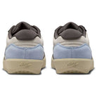 The DV5477102 Light Orewood Brown Medium Aah Force 58 Nike SB suede skateboarding shoes are shown from the back, with light blue suede heels, beige cupsoles, white uppers, and dark gray padded collars.