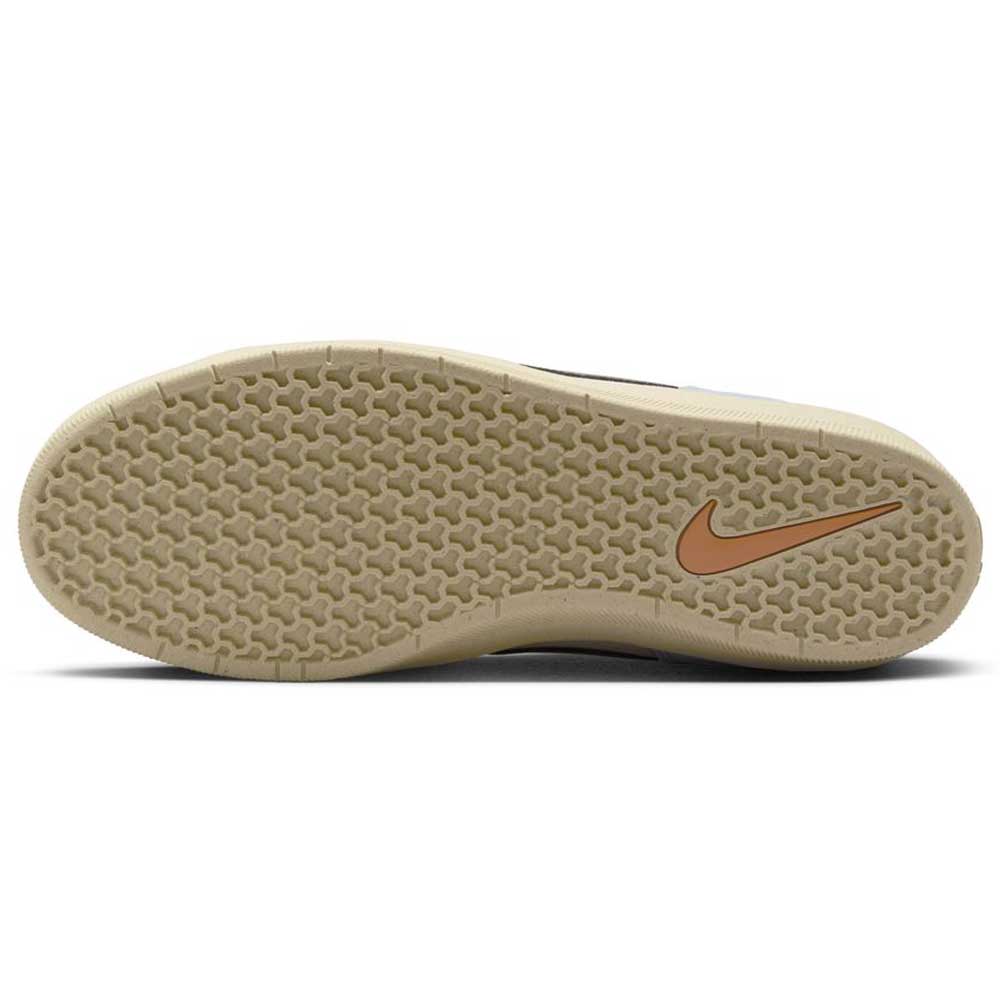 The image shows the beige cupsole and honeycomb tread of the DV5477-102 Light Orewood Brown Medium Aah Force 58 Nike SB suede skateboarding shoes, with an orange Nike Swoosh logo near the heel.