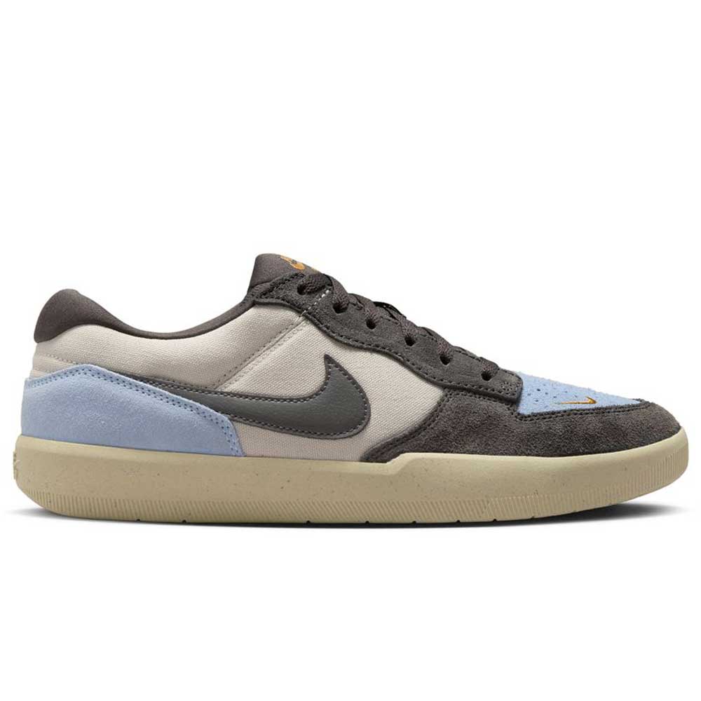The DV5477-102 Light Orewood Brown Medium Aah Force 58 Nike SB features a beige and light blue suede upper, dark gray laces and swoosh, a light tan cupsole, and a low-top design, offering a modern look perfect for skateboarding.