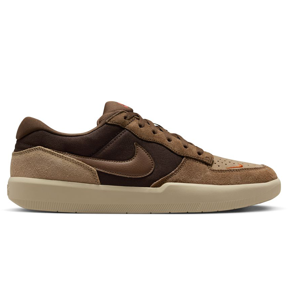 The DV5477-201 Baroque Brown Mosswood Brown Force 58 Nike SB suede skateboarding shoe features a brown and tan upper, beige sole, black laces, and orange accents—blending basketball-inspired design with skate-ready style. Shown in side profile on white.