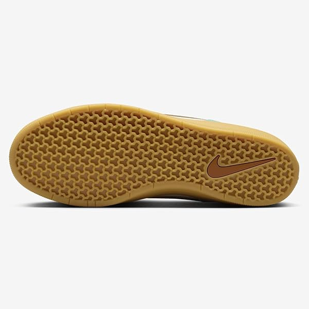 The image shows the gum-colored sole of the DV5477-302 Green Frost Dark Russet Force 58 Nike SB suede shoes, featuring a textured honeycomb pattern and a brown Nike Swoosh logo near the heel against a plain white background.
