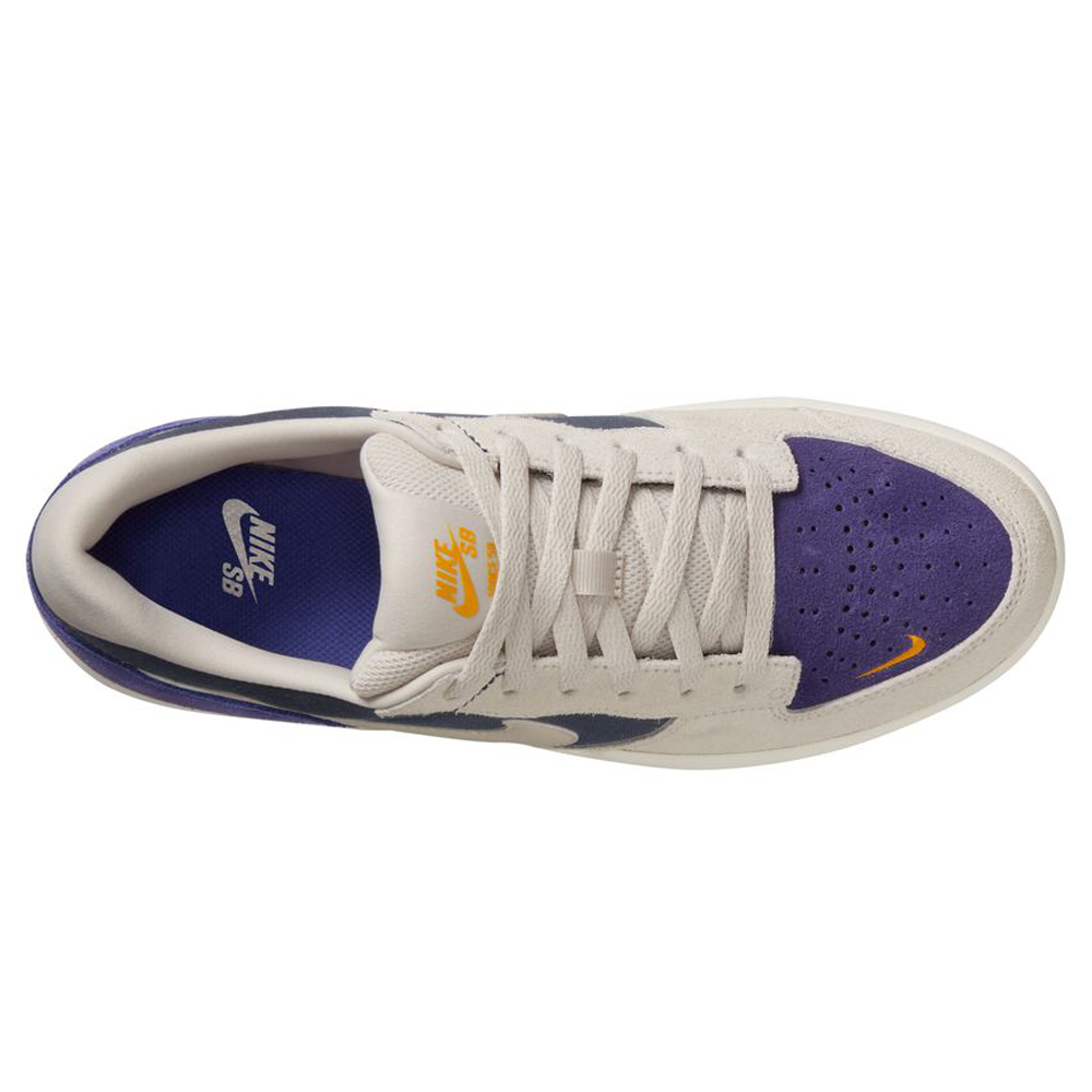 Top view of the DV5477-403 Obsidian Light Orewood Brn Force 58 Nike SB suede skateboarding shoes, showing beige laces, trim, a purple toe box and sides, an orange mini Swoosh on the toe, and orange Nike branding on the insole and tongue.