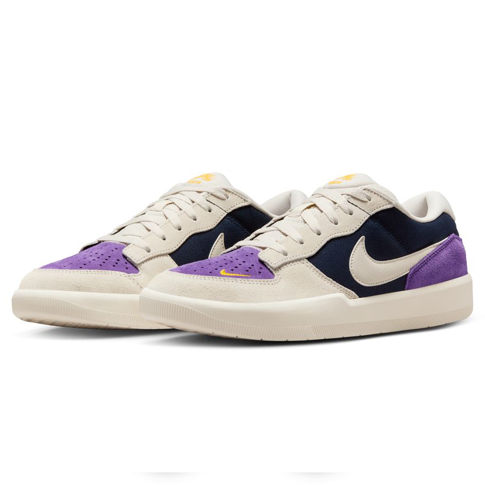 The DV5477-403 Nike SB Force 58 Suede Skateboarding Shoes feature a beige sole, Obsidian/navy panels, purple toe and heel accents, white swooshes, and yellow details—blending cupsole skate style with basketball-inspired design.