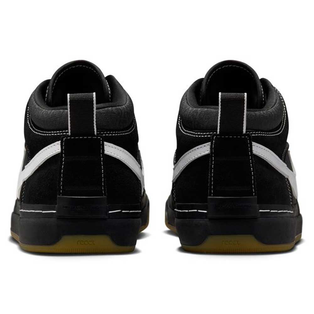 The DX4361-005 Black Gum Leo Baker React Nike SB skate shoes feature black suede and leather uppers, white stitching, white side accents, black pull tabs on the heels, and durable gum-colored outsoles for skateboarding.