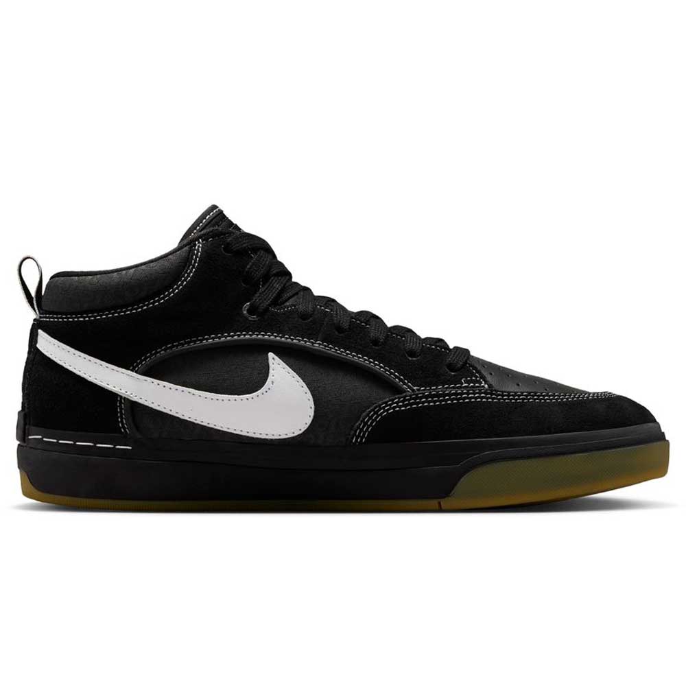The DX4361005 Black Gum Leo Baker React Nike SB features black suede leather, a white swoosh, black laces, and a gum sole. Designed for skateboarding, these mid-top shoes are inspired by Leo Baker and shown in side profile on a white background.
