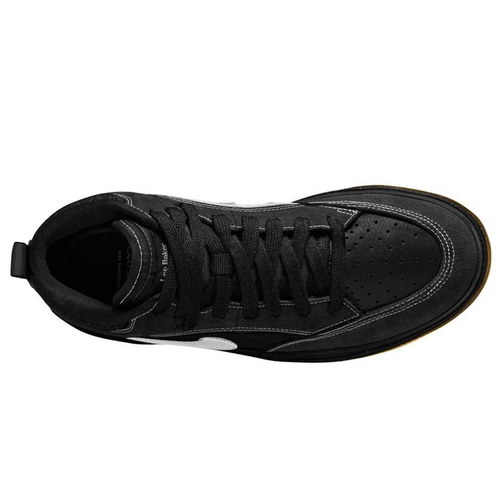 Top view of the DX4361005 Black Gum Leo Baker React Nike SB suede leather skateboarding shoe in black, featuring a white side accent, black laces, perforated toe box, and a textured black sole.