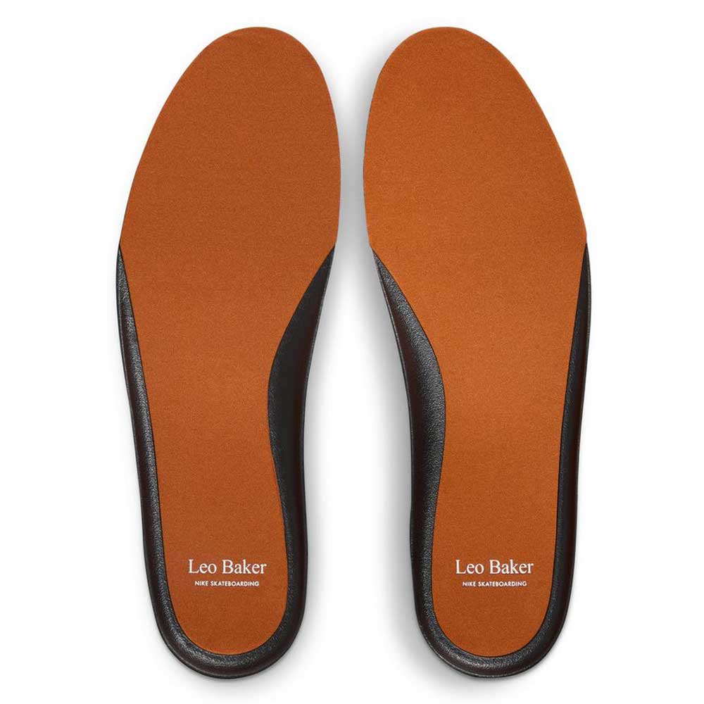 Orange and black insoles from the Leo Baker x Nike SB DX4361202 Dark Rust White React skateboarding shoes, featuring "Leo Baker" and "Nike Skateboarding" in white on each heel.