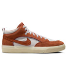 A side view of the DX4361-202 Dark Rust White React Leo Nike SB skateboarding shoe featuring a white base, burnt orange suede and leather overlays, white laces, a cream sole, and a large orange Nike Swoosh on the side and heel.