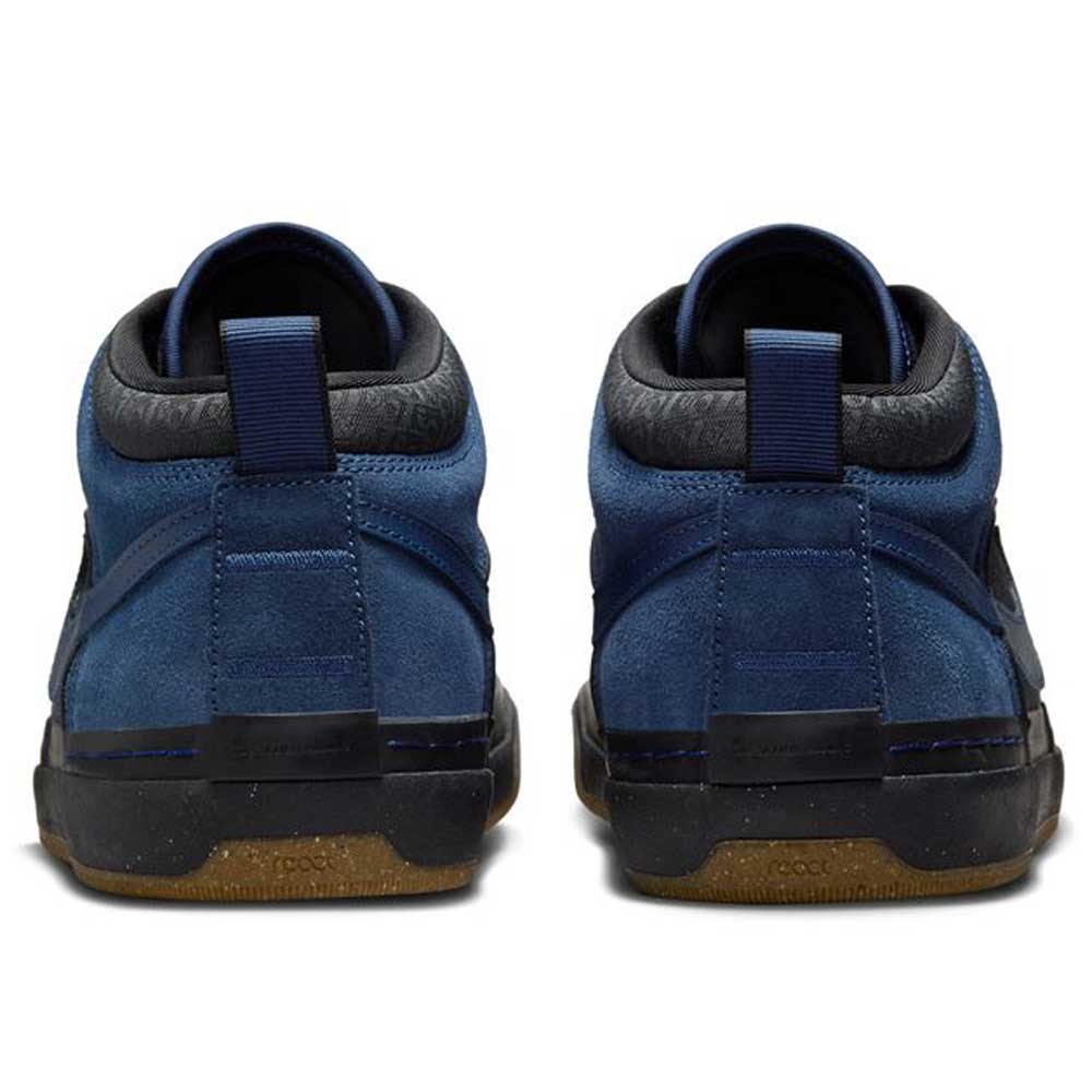 The DX4361-401 Navy Black Anthracite Leo Baker React Nike SB suede leather skateboarding shoes are shown from the back, highlighting black trim, blue pull tabs, and gum-colored outsoles.