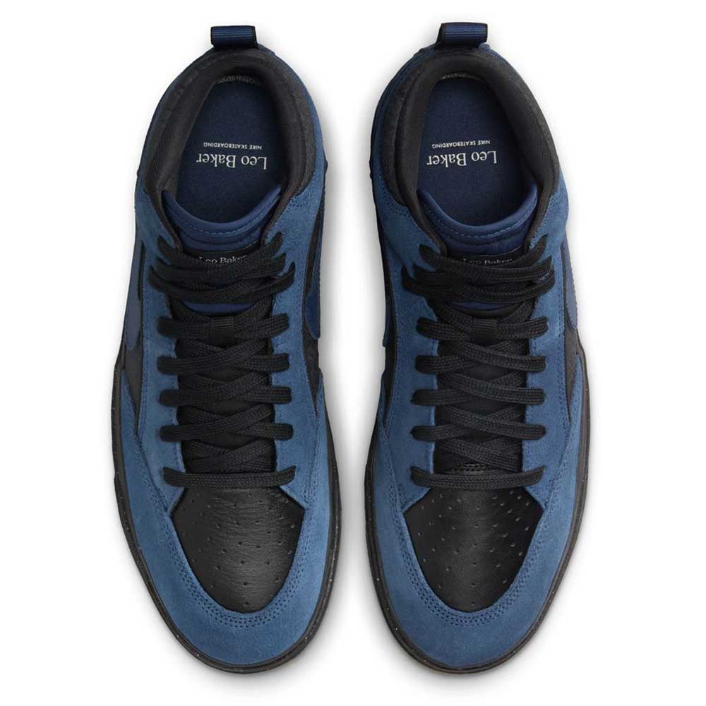 A pair of Nike SB Leo Baker React skateboarding shoes in Navy Black Anthracite, made of suede leather, viewed from above with black laces and toe boxes, blue overlays, and branded insoles.