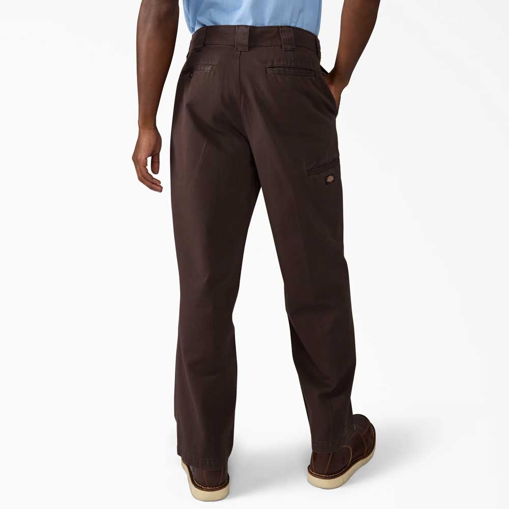 A person stands with hands in pockets, back facing the camera, wearing Dickies Skateboarding Dark Brown Worn In Double Knee Pant (A89TC0DB) and brown shoes against a plain white background.