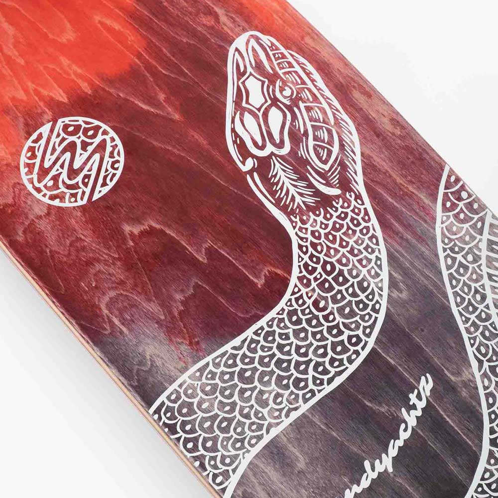 The Drop Cat Python 38 Landyachtz Complete Skateboard is a drop-through longboard with a red and brown wood grain finish, showcasing a detailed white illustrated snake and a circular decorative logo on the left.
