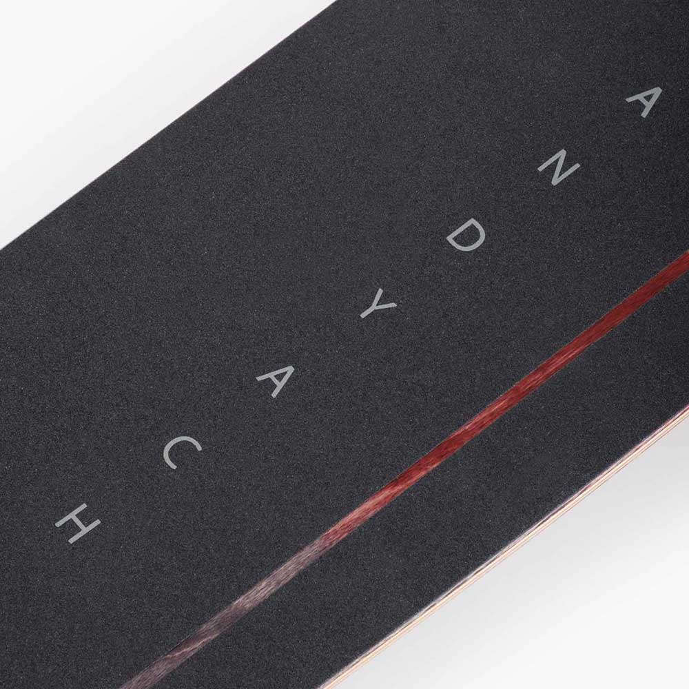 A close-up of the Drop Cat Python 38 Landyachtz Complete Skateboard, featuring a black drop-through deck with a red stripe and light gray lettering spaced out across the grip tape.