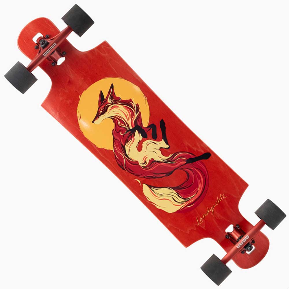 The Drop Hammer Sun Fox Landyachtz Complete Skateboard features a red drop-through deck with black wheels and trucks, and artwork of a red fox with a bushy tail in front of a yellow sun—ideal for beginners or Landyachtz Drop Hammer fans.