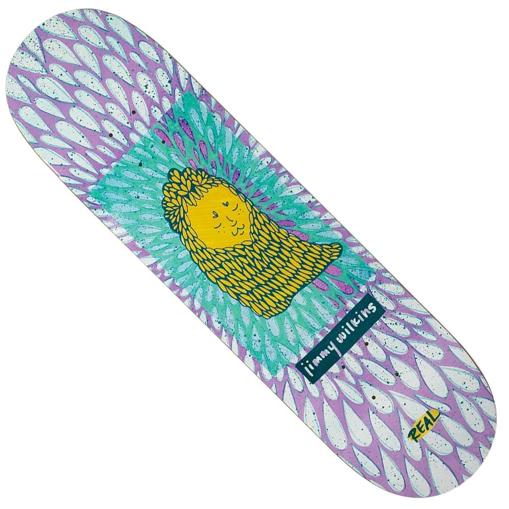 The Echos Wilkins 8.5 Real Skateboard Deck features a vibrant cartoon yellow lion with a wavy mane, teal and purple feather patterns, and the names Jimmy Wilkins and REAL, reflecting Wilkins' playful style.