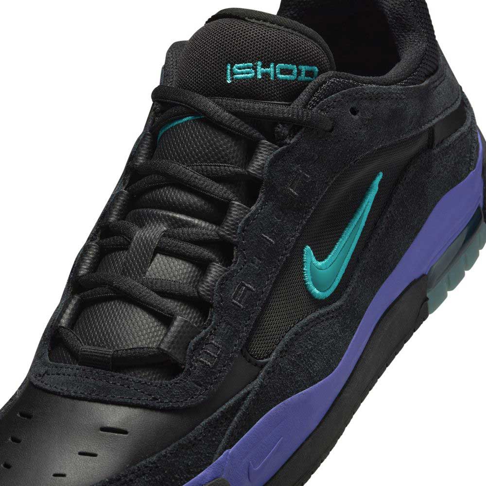 Close-up of FB2393-003 Dusty Cactus Black Air Max Ishod Wair shoes, featuring a teal Swoosh, teal ISHOD tongue text, purple midsole, leather and suede upper, and Max Air technology for comfort and support.
