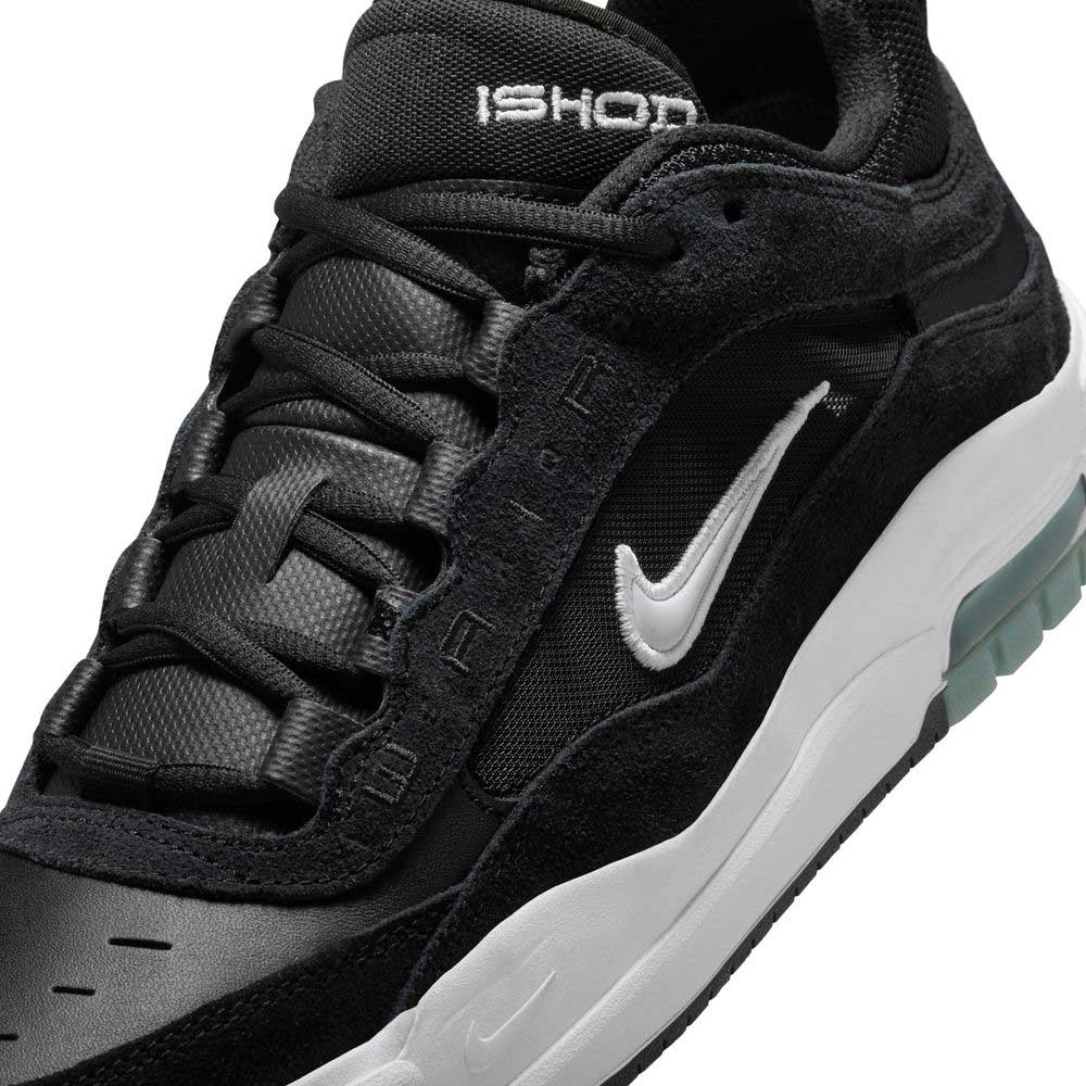 Close-up of the FB2393-004 Air Max Ishod Wair skate shoe in black with a white sole and Swoosh. “ISHOD” is on the tongue, “D.A.R.P.” on the side, and Max Air cushioning offers comfort. Features black laces and textured leather-suede panels.