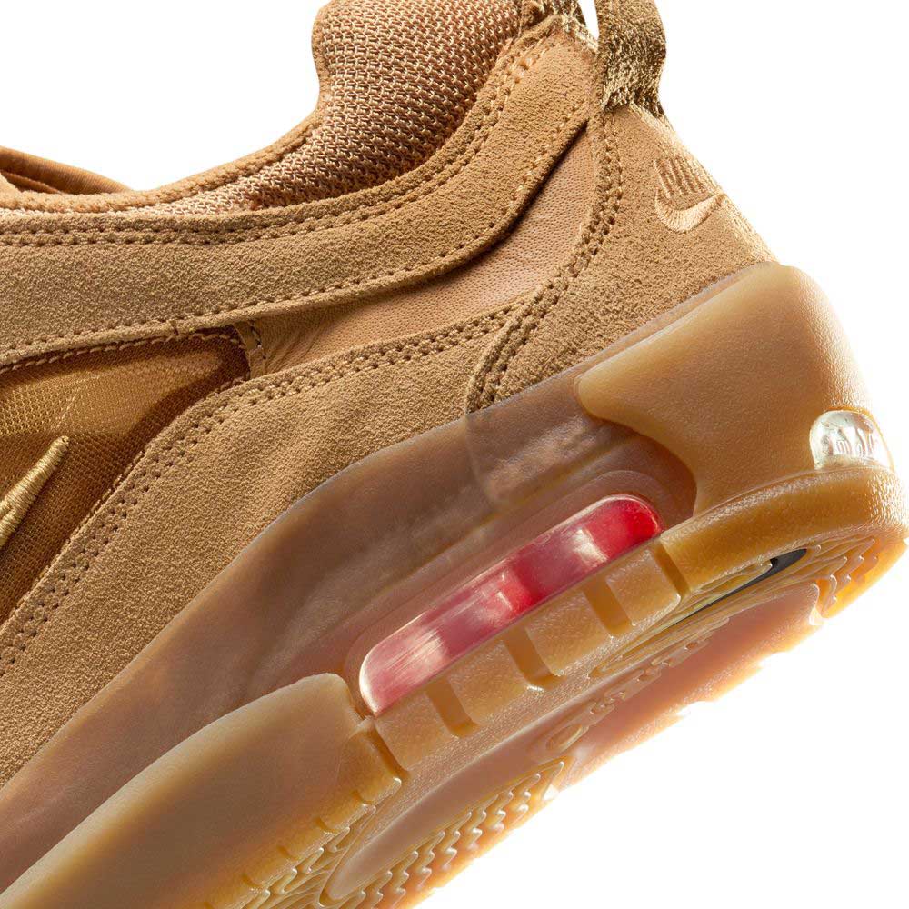 Close-up of the FB2393-200 Flax Brown Air Max Ishod Nike SB skate shoe, featuring a leather and suede upper, visible heel air cushion, translucent gum rubber sole, and embossed Nike logo—showcasing the latest in skateboarding footwear.