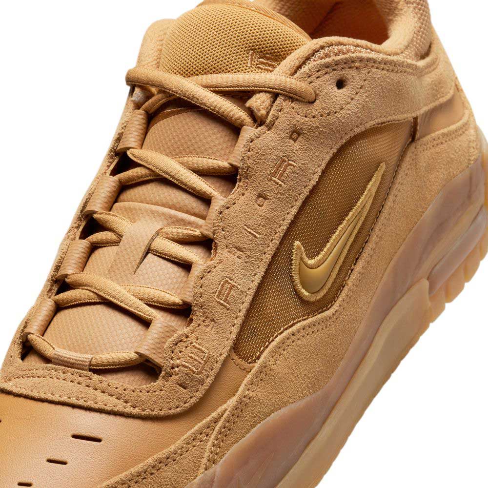 Close-up of the FB2393200 Flax Brown Air MAX Ishod Nike SB skateboarding shoe, featuring a tan suede and mesh upper, gold swoosh, “AIR” embossing on the eyelet panel, thick laces, and a textured rubber sole.