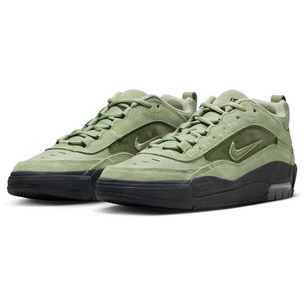 The FB2393-300 Green Black Air MAX Ishod Nike SB shoes feature suede and leather uppers, small silver Swooshes, black rubber soles, and a skate-inspired design, displayed on a white background.